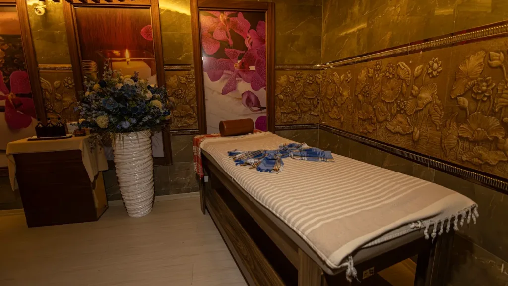 Promotional image showcasing Anatolia Hamam special packages, featuring traditional Turkish bath ambiance with scrub, foam massage, and spa treatments.